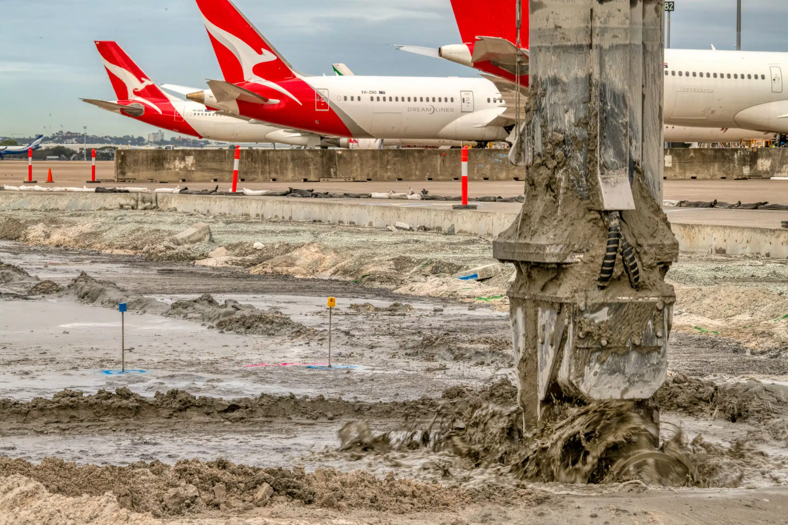 Image of a Mass Soil Mixing Rig with 3 Airplanes in the Background